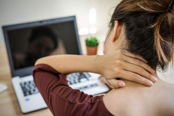 Young woman working at home and having neck pain, Healthcare and problem concept office syndrome