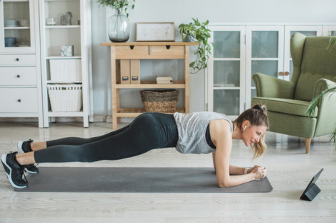 Women at home during pandemic isolation doing workout to stay in shape