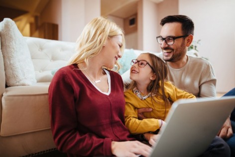 Family using laptop at home