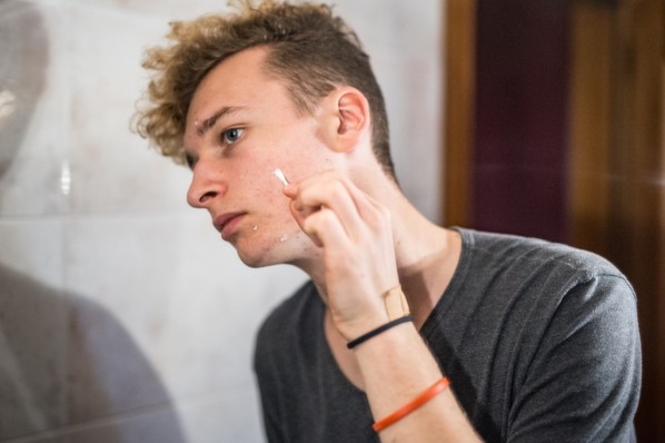 Teenage Boy Cleaning His Pimples